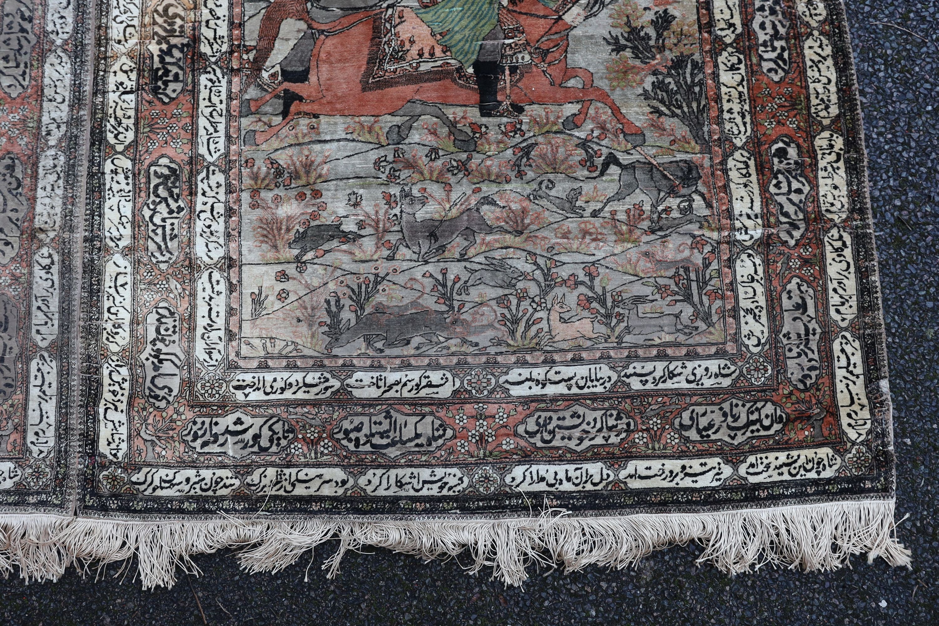 A pair of late 19th/ early 20th century Kashan silk pictorial rugs, woven with nobleman over hunters on horseback. 220 x 130cm.